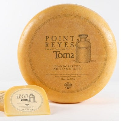 A wedge of Toma cheese, available at our Provincetown liquor store, Perry's.